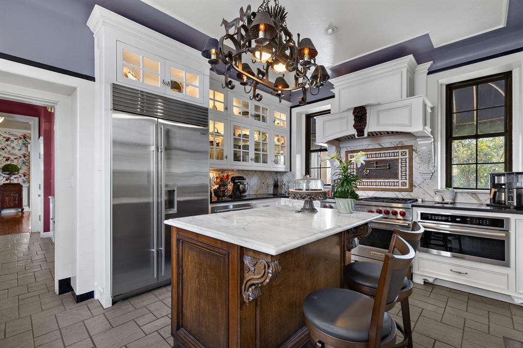 3100 Hamilton Boulevard Wichita Falls, TX 76308 - Photo 17 of 40 a kitchen with a table chairs refrigerator and cabinets
