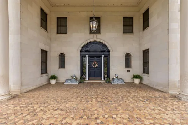 a view of a livingroom with furniture and natural light