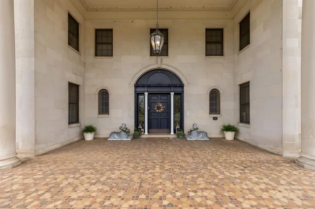 a view of a livingroom with furniture and natural light