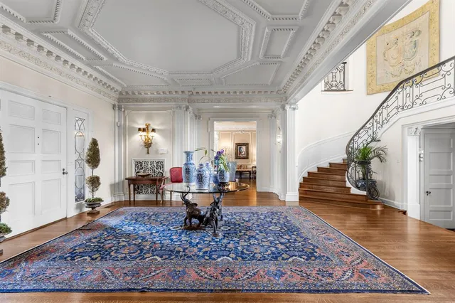 a living room with furniture and a rug