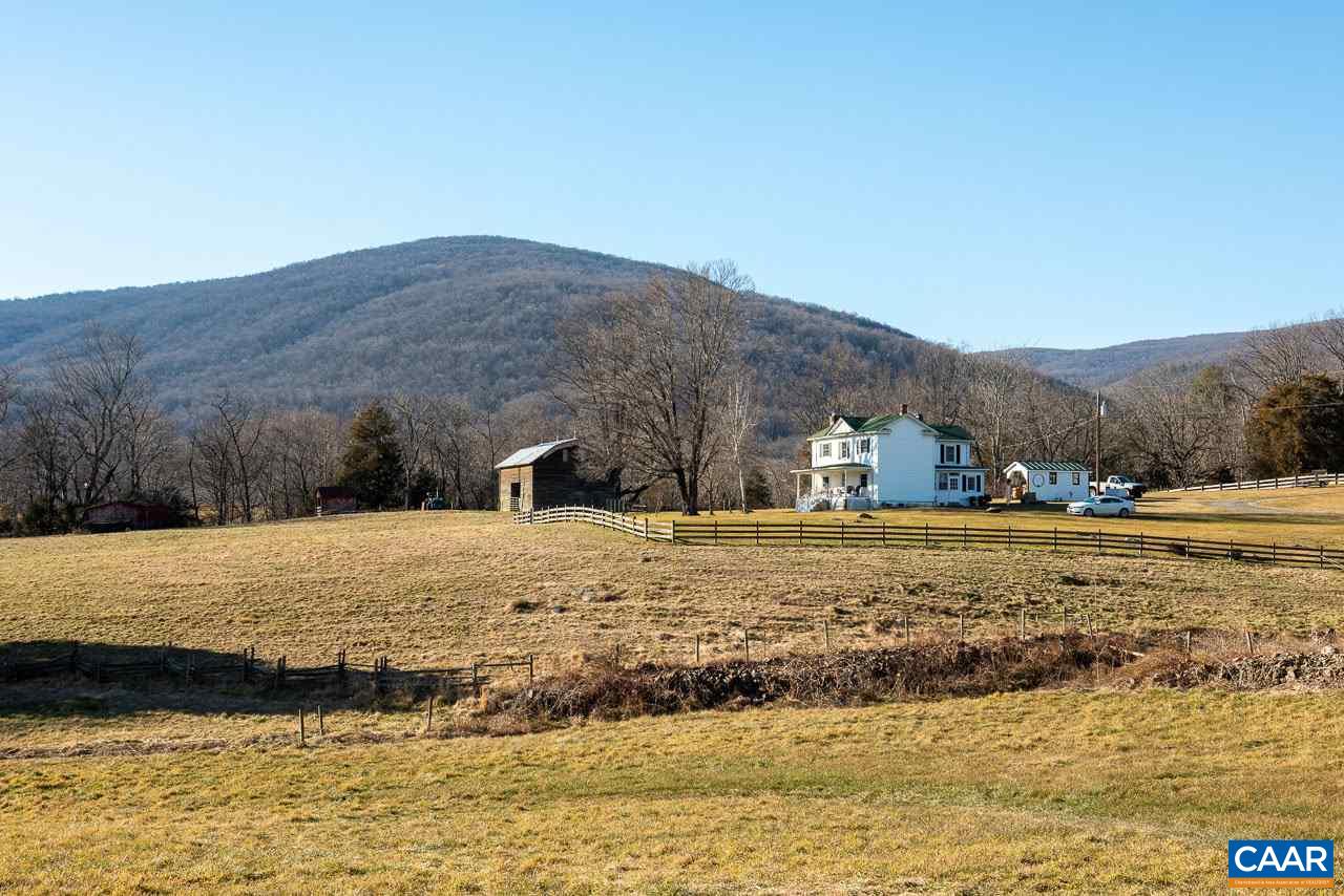 815 Foothills Road Stanardsville, VA 22973 - Photo 1 of 15 a view of a lake with a mountain