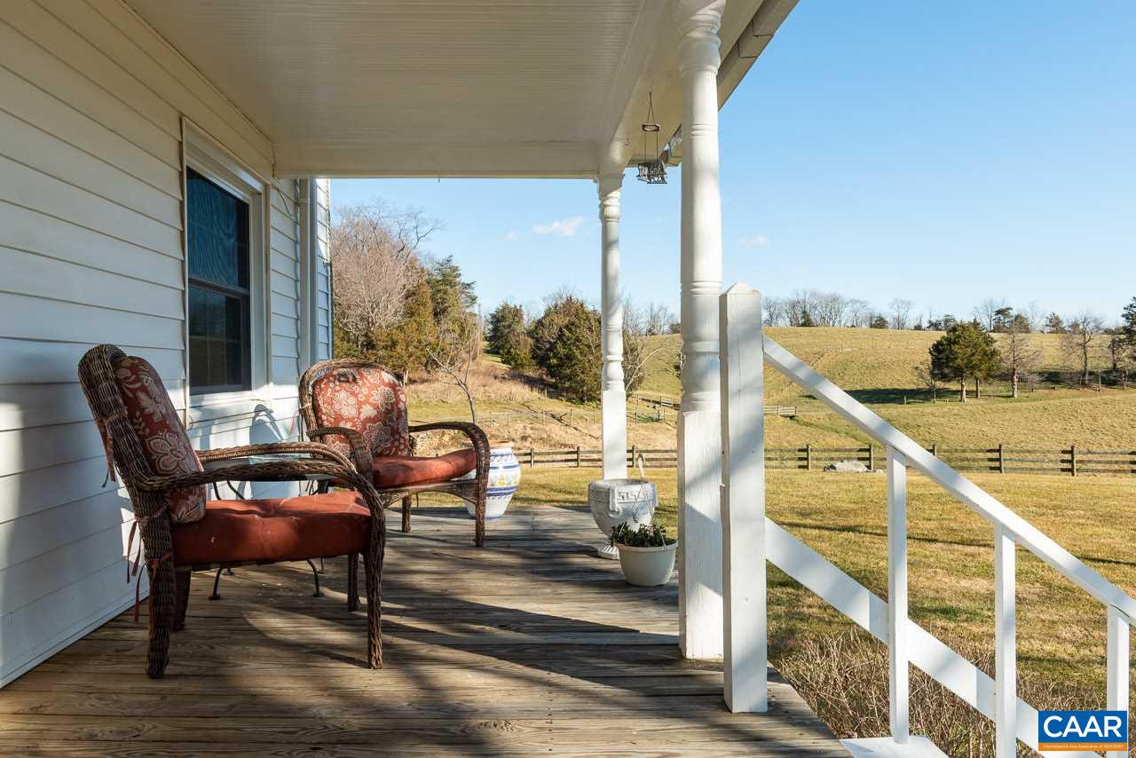 815 Foothills Road Stanardsville, VA 22973 - Photo 5 of 15 a balcony view with a large window and sitting space