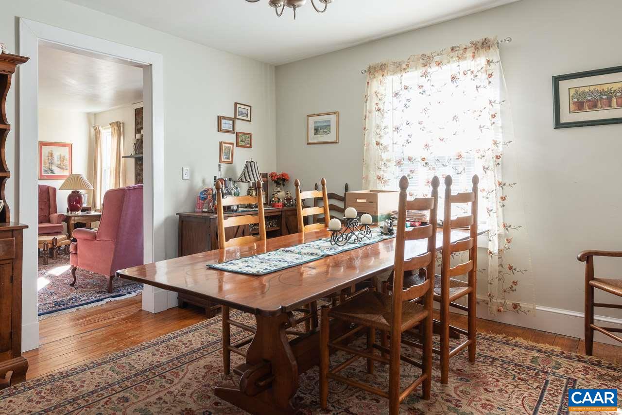 815 Foothills Road Stanardsville, VA 22973 - Photo 8 of 15 a view of a dining room with furniture window and wooden floor
