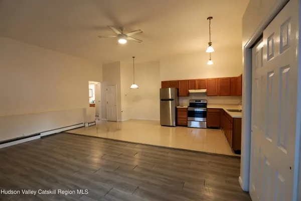 a view of a kitchen with a sink and a window