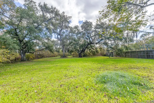 a view of outdoor space with deck and yard