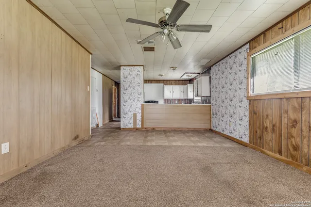 a view of livingroom with hardwood floor and ceiling fan