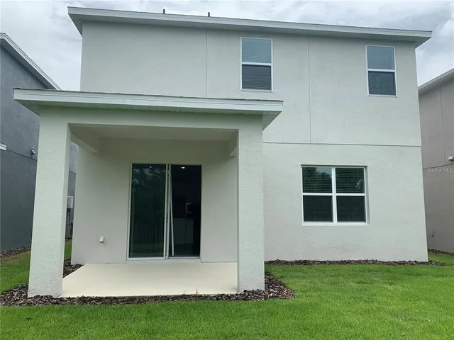 a view of a deck with a table and a chairs