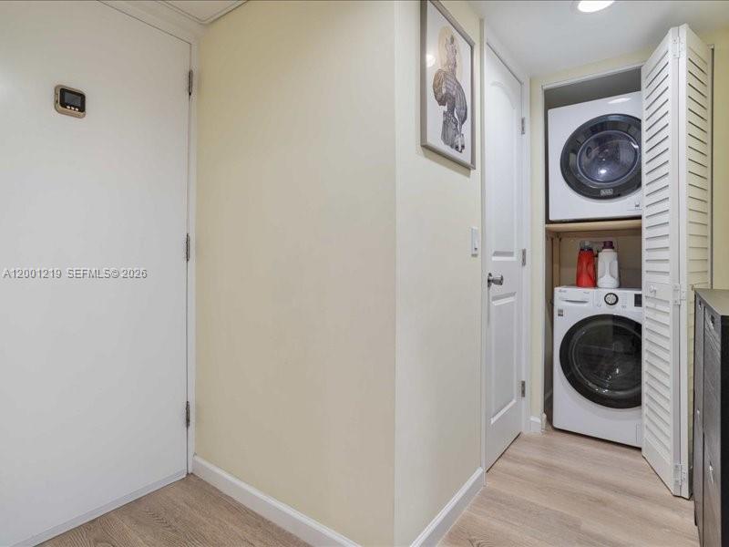6193 Rock Island Road, Unit 105 Tamarac, FL 33319 - Photo 13 of 24 a view of a hallway with washer and dryer