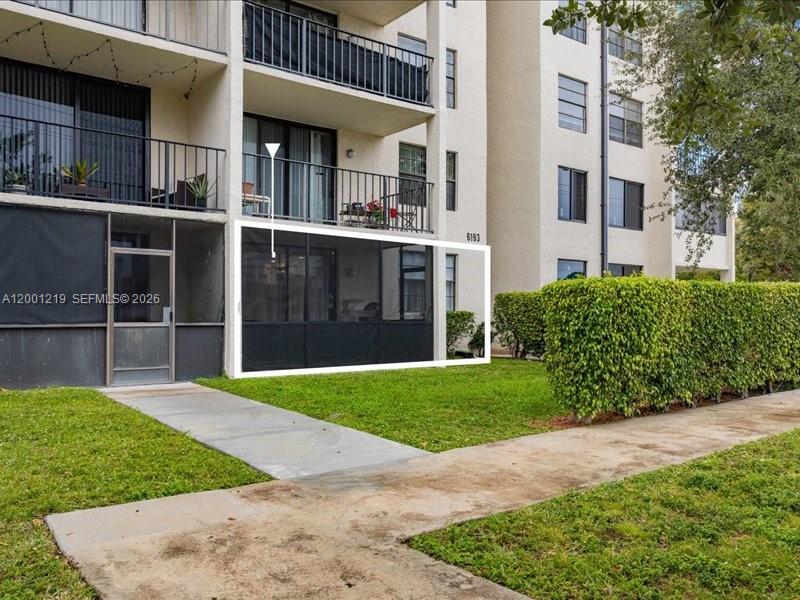 6193 Rock Island Road, Unit 105 Tamarac, FL 33319 - Photo 21 of 24 a view of a house with a garden