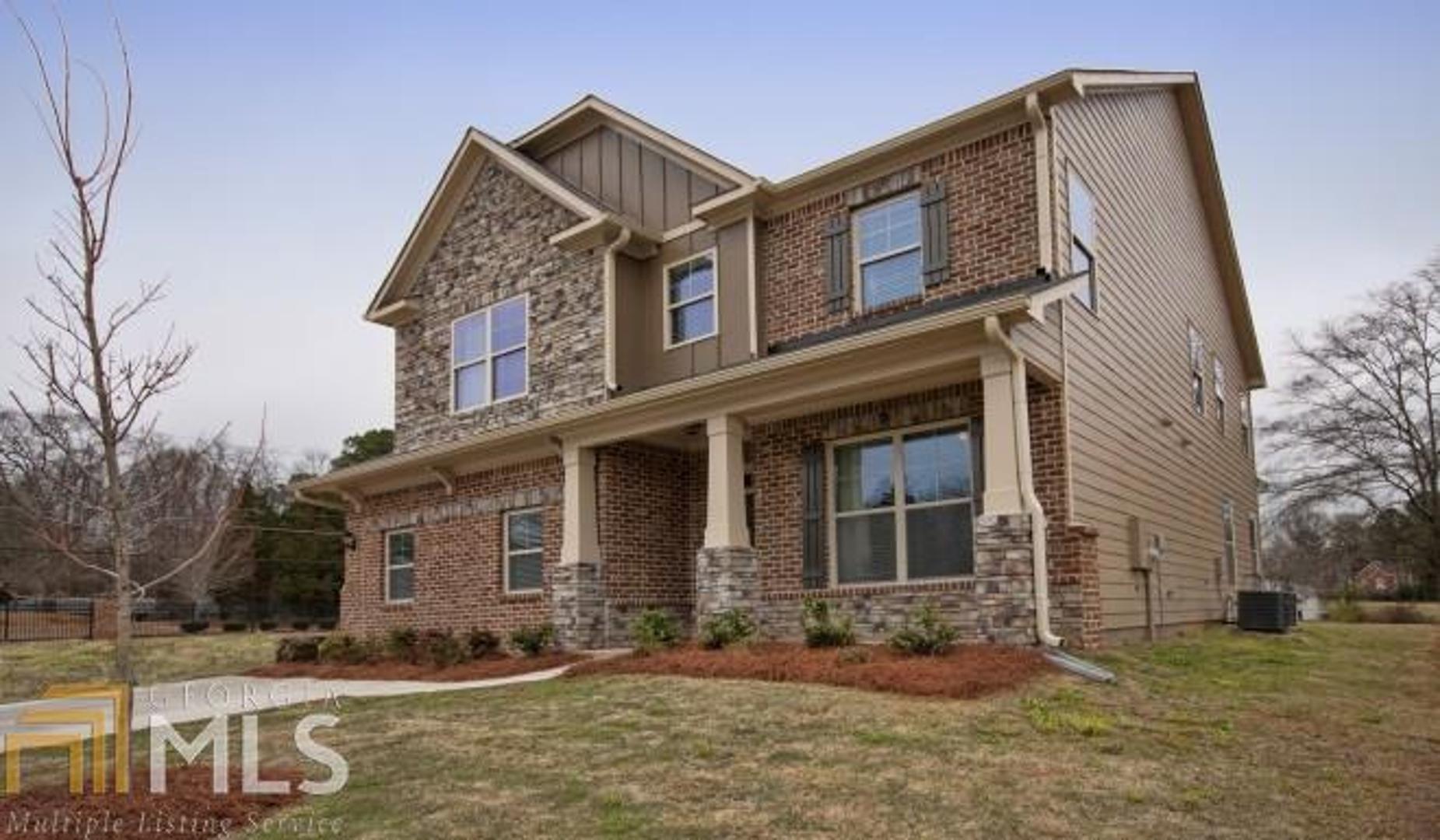 1408 Stone Ridge Court, Unit 257 Hampton, GA 30228 - Photo 1 of 1 front view of a house with a yard
