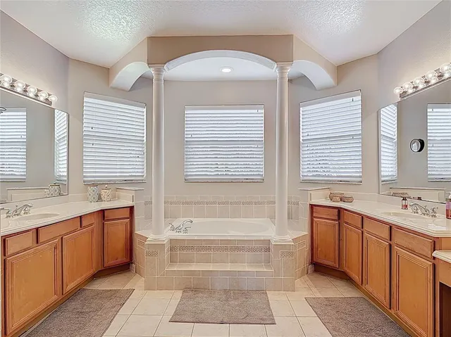 a bathroom with a shower a toilet and a shower