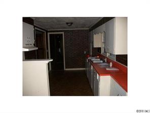 2537 Hillian-Edwards Road Cheraw, SC 29520 - Photo 3 of 13 a kitchen with a sink and a refrigerator