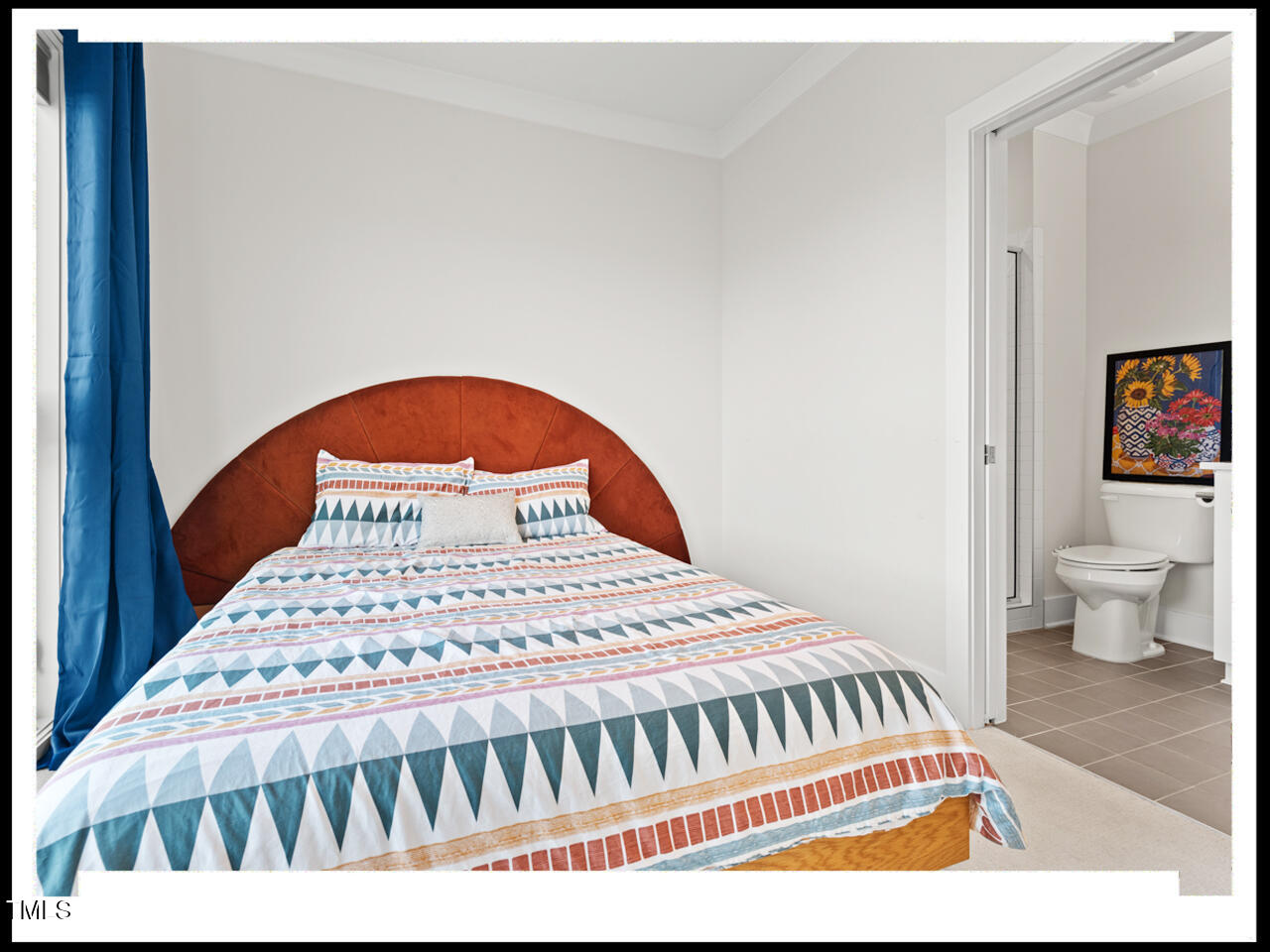 712 East Edenton Street, Unit 105 Raleigh, NC 27601 - Photo 32 of 48 a bedroom with a bed and a view of bathroom