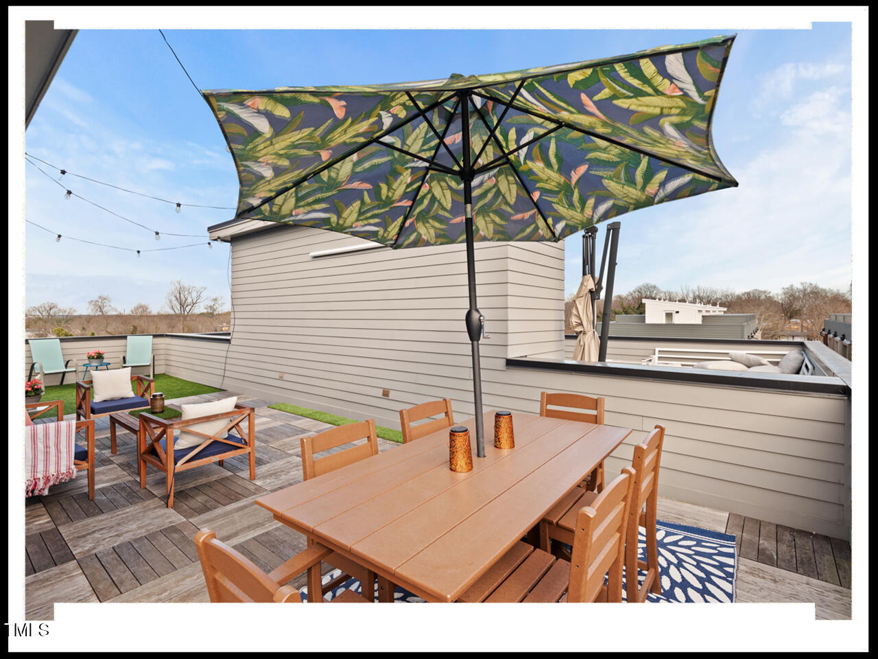 712 East Edenton Street, Unit 105 Raleigh, NC 27601 - Photo 36 of 48 a terrace with outdoor seating and city view