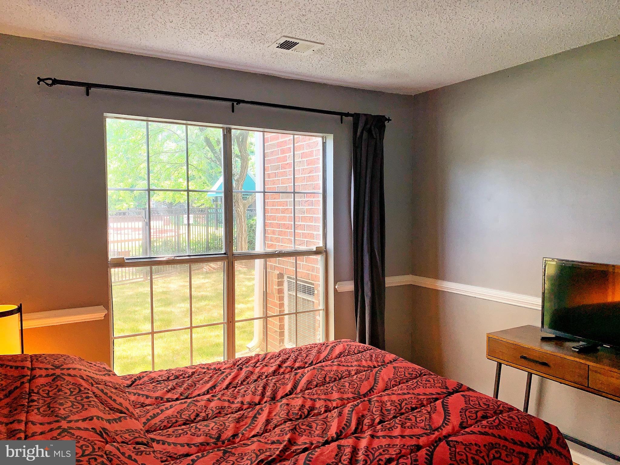 21029 Timber Ridge Terrace, Unit 102 Ashburn, VA 20147 - Photo 14 of 39 View to the pool.