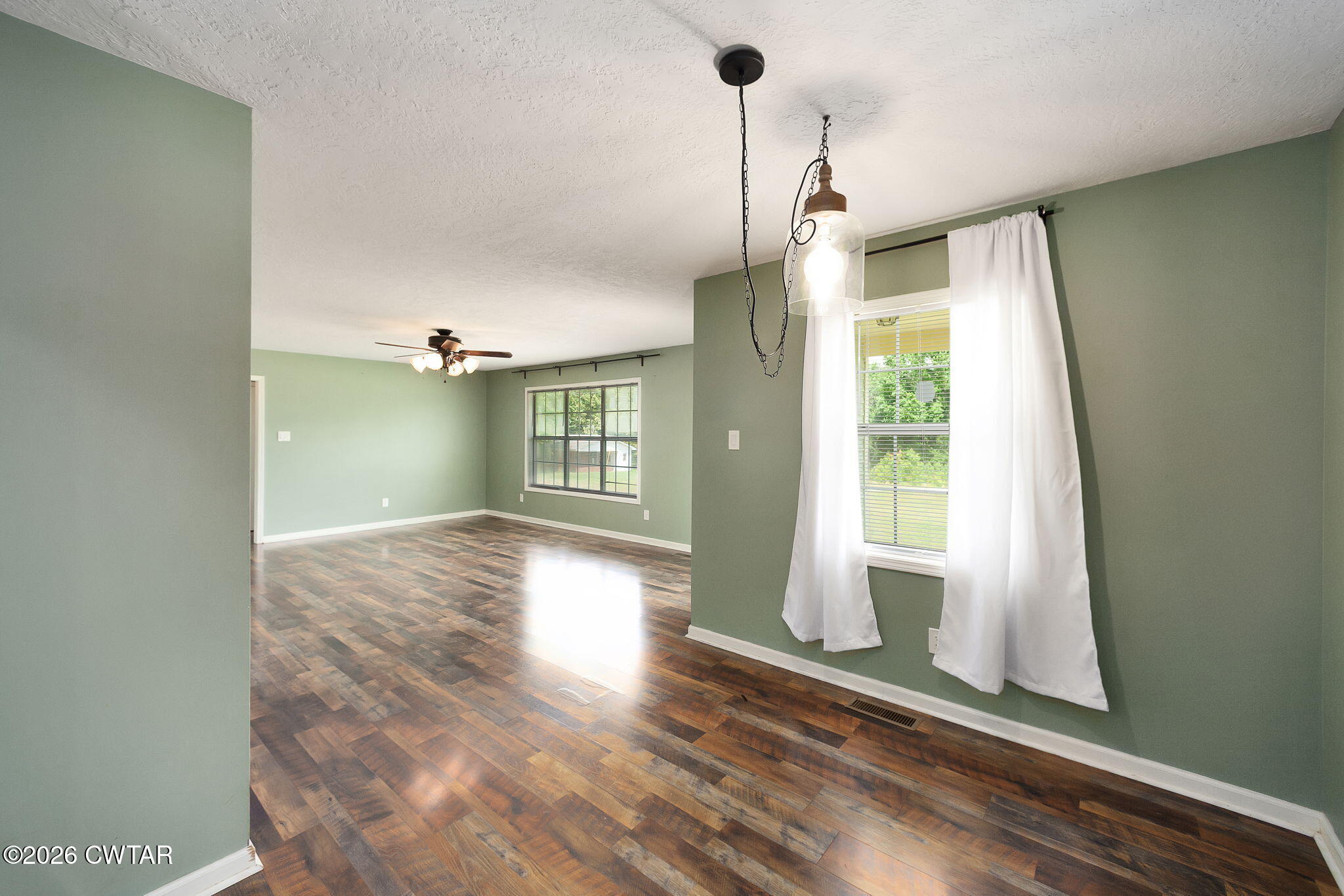 306 Jim Jackson Road Humboldt, TN 38343 - Photo 9 of 29 a view of empty room with wooden floor and fan