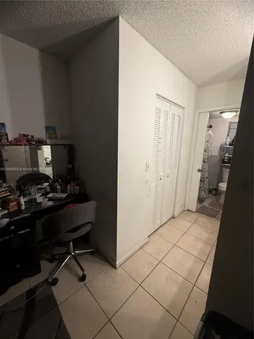 a view of a workspace with furniture