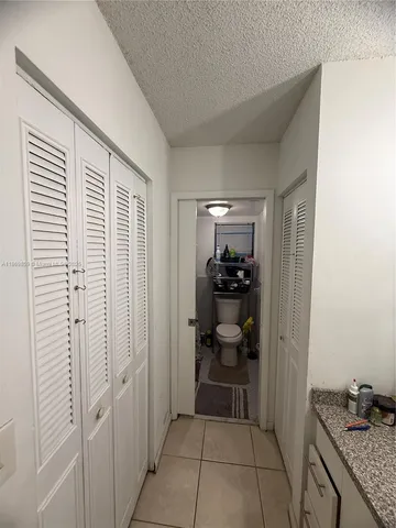 a view of a storage & utility room and utility room