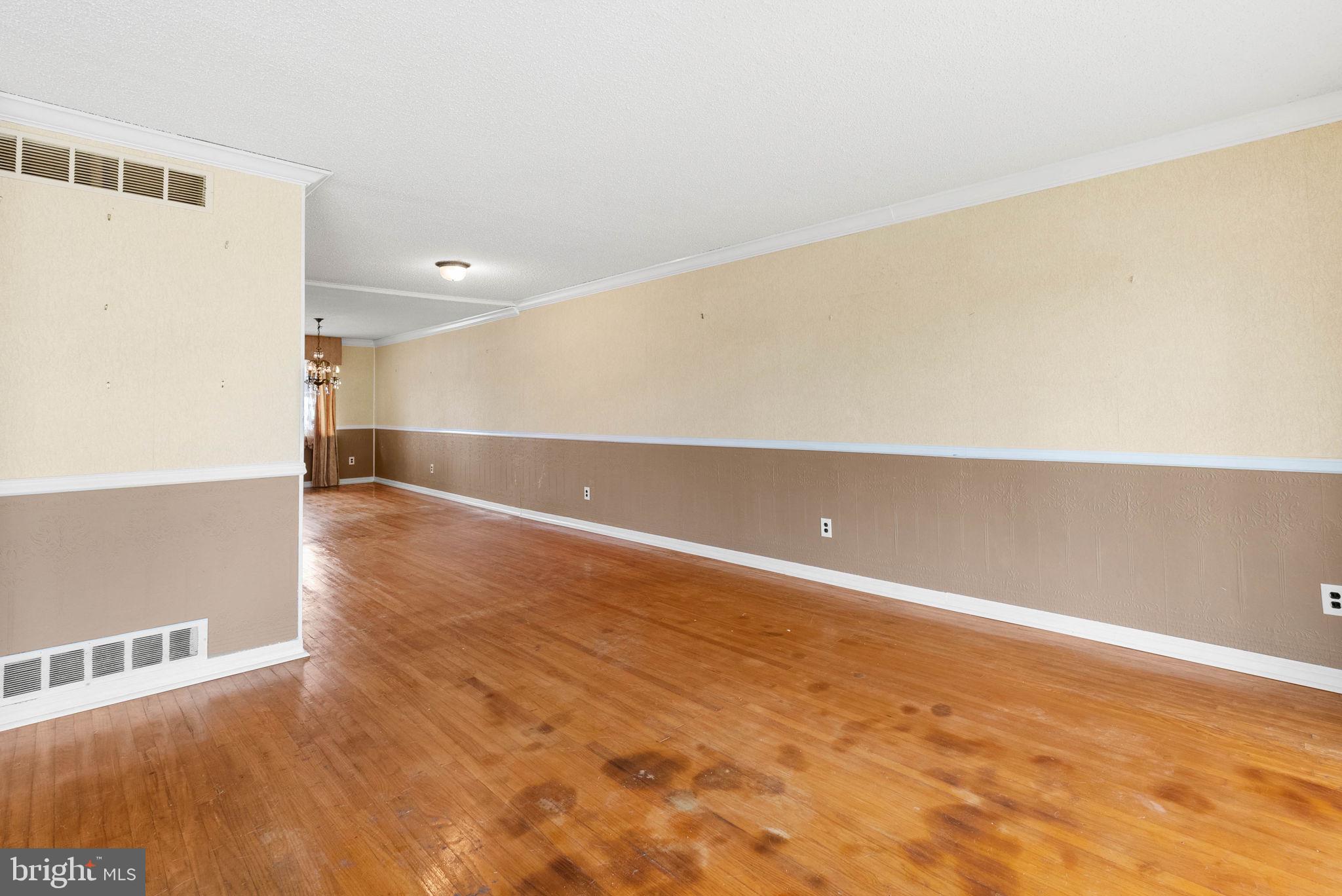 711 George Lane Glendora, NJ 08029 - Photo 11 of 43 a view of an empty room with wooden floor