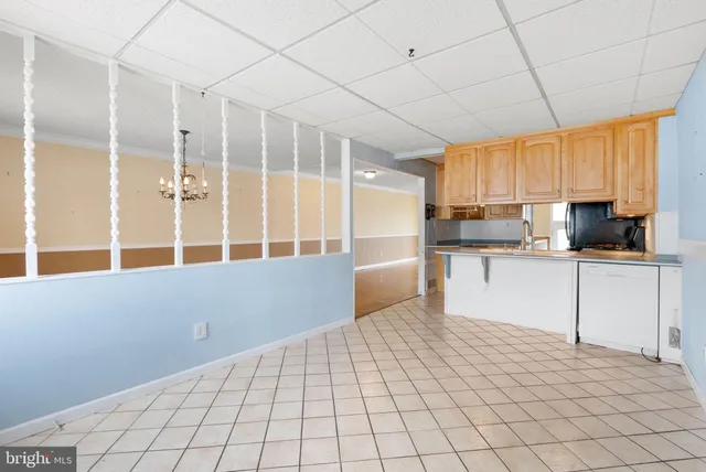 a kitchen with stainless steel appliances a cabinets and a refrigerator