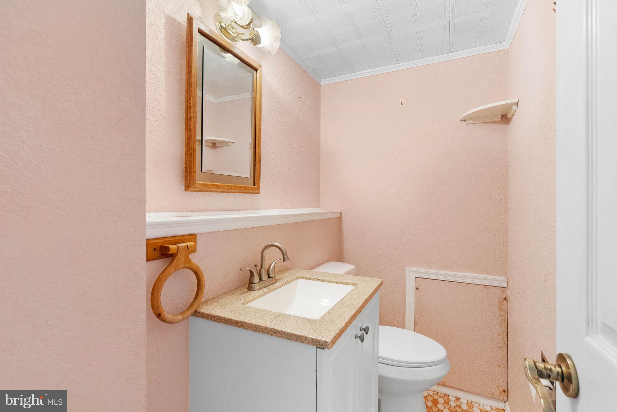 711 George Lane Glendora, NJ 08029 - Photo 22 of 43 a bathroom with a toilet sink and mirror