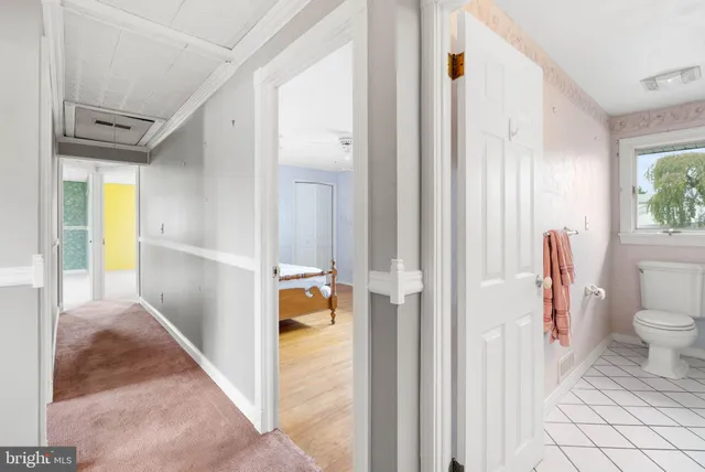 a view of a bathroom from a hallway