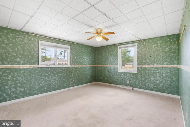 a view of an empty room with a window