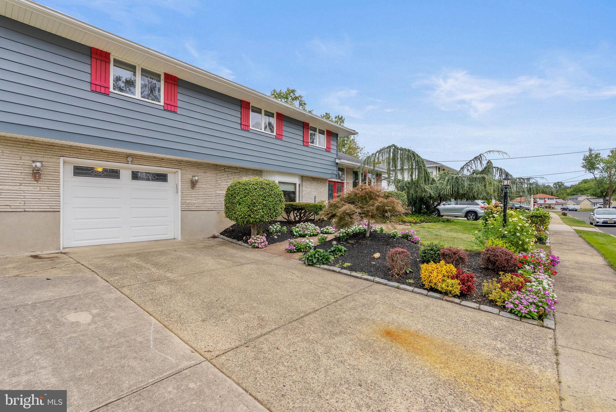 711 George Lane Glendora, NJ 08029 - Photo 3 of 43 front view of a house with a yard