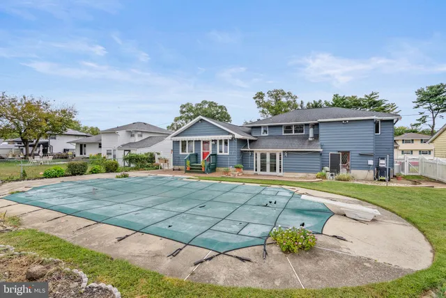 a front view of house with yard outdoor seating and barbeque oven