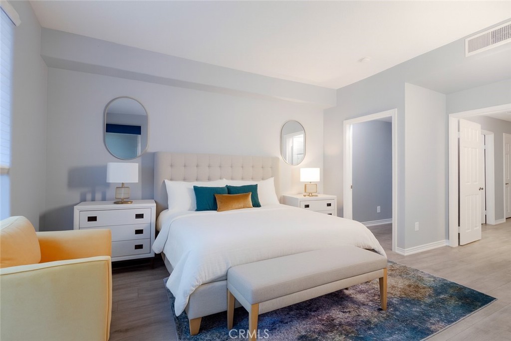2233 Martin, Unit 108 Irvine, CA 92612 - Photo 8 of 31 a bedroom with a bed and a couch