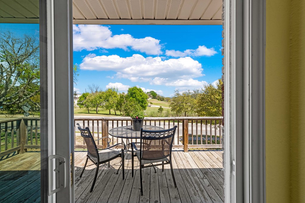 825 Golf Street Kerrville, TX 78028 - Photo 15 of 38 a view of a chairs and table in the balcony