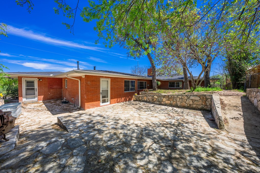825 Golf Street Kerrville, TX 78028 - Photo 22 of 38 a front view of a house with a yard