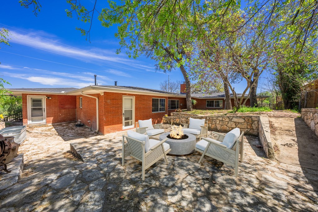 825 Golf Street Kerrville, TX 78028 - Photo 23 of 38 a view of a backyard with sitting area