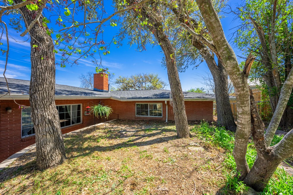 825 Golf Street Kerrville, TX 78028 - Photo 24 of 38 a view of house with backyard and a tree