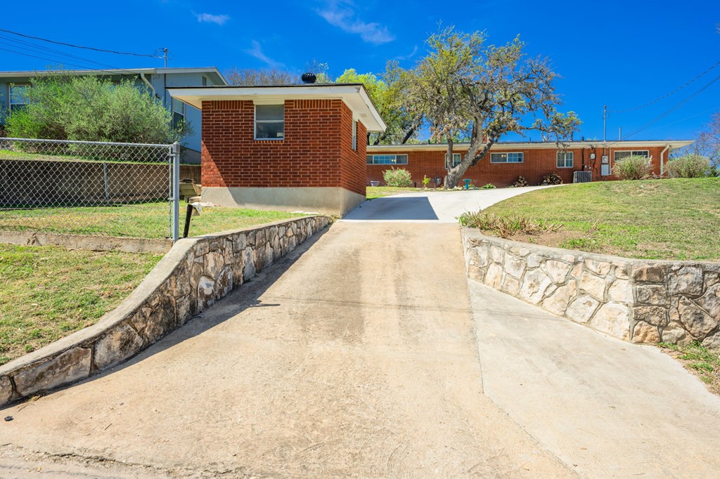 825 Golf Street Kerrville, TX 78028 - Photo 27 of 38 a view of a backyard
