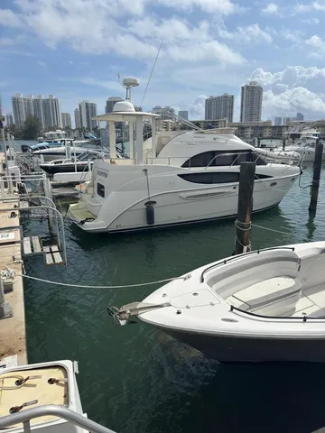 a view of a roof deck with table and chairs