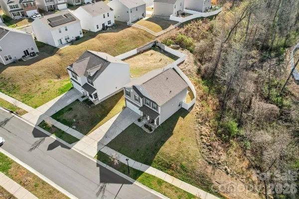 an aerial view of a house with a garden