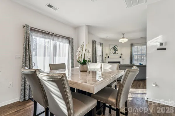 a dining room with furniture and window