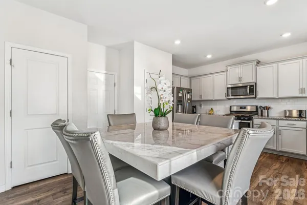 a kitchen with stainless steel appliances granite countertop a white cabinets and a granite counter tops