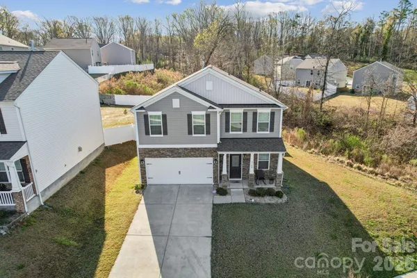 a aerial view of a house with swimming pool