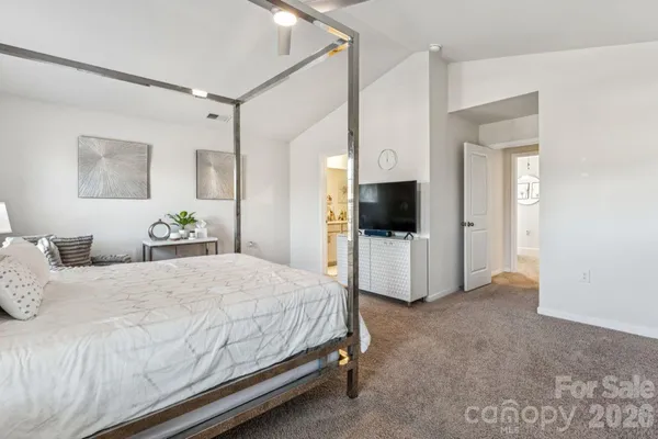 a bed room with a bed and a table