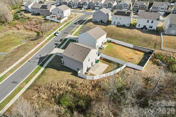 an aerial view of a house with a garden