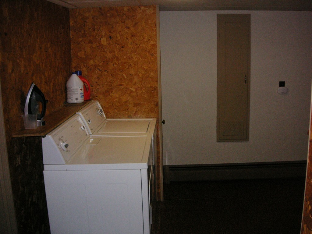 20 Natchez Street Lowell, MA 01850 - Photo 12 of 14 a bathroom with a sink and a shower