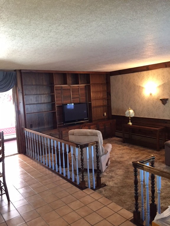 20 Natchez Street Lowell, MA 01850 - Photo 14 of 14 a view of barbeque area with wooden floor