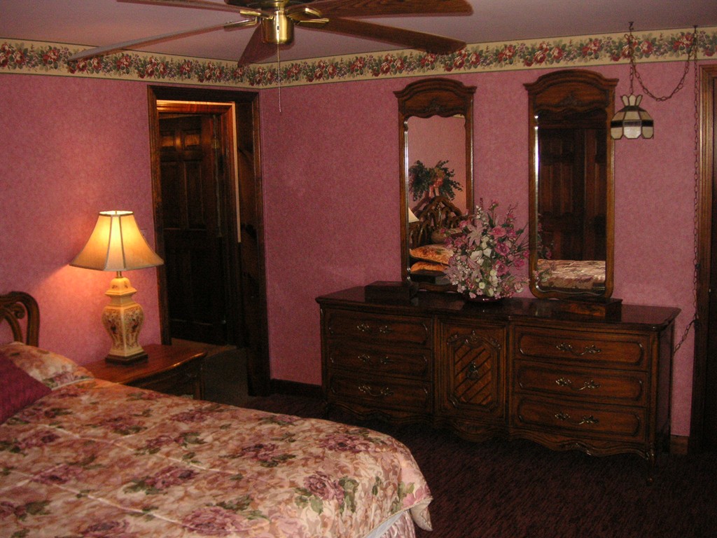 20 Natchez Street Lowell, MA 01850 - Photo 5 of 14 a bedroom with a bed and a dresser