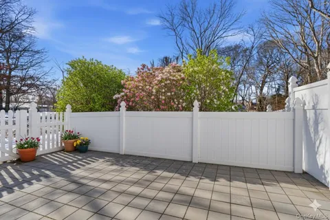 a view of white fence of a house