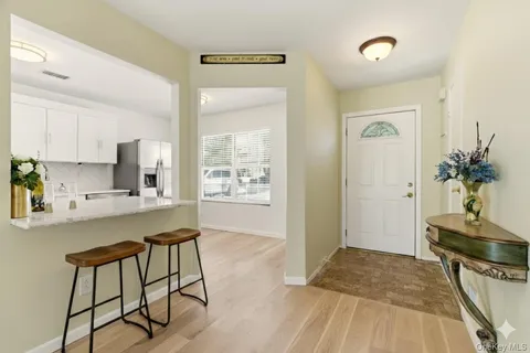 a kitchen with stainless steel appliances granite countertop a stove sink and cabinets