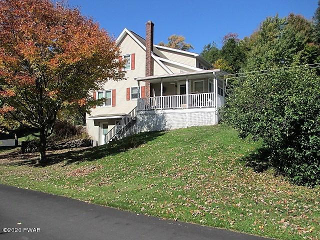 996 Cortez Road Lake Ariel, PA 18436 - Photo 2 of 55 a front view of a house with a yard