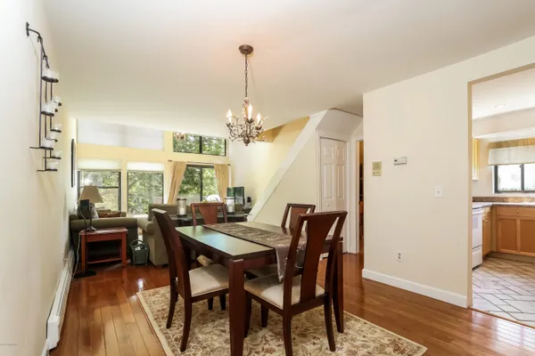 a view of a dining room with furniture window and wooden floor