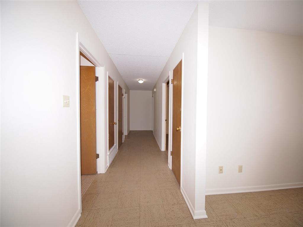 1441 Brazos Street Graham, TX 76450 - Photo 11 of 34 a view of a hallway with closet area